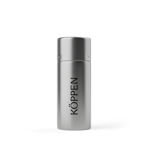 Silver floss container with 'Köppen' branding on a white background