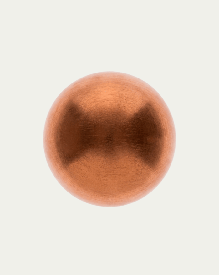 Copper sphere on a light gray background