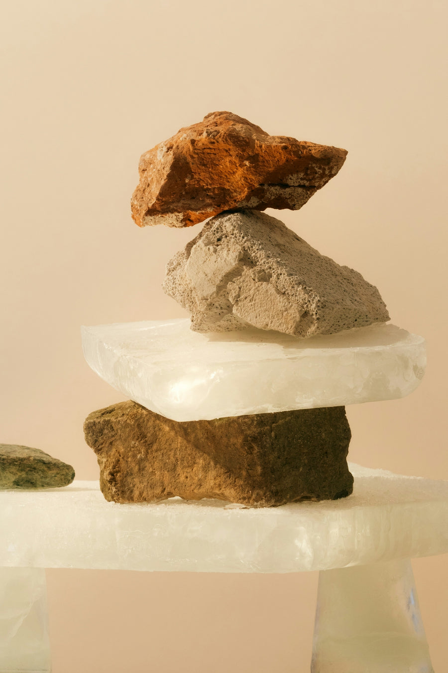 Stack of assorted stones balanced on each other.