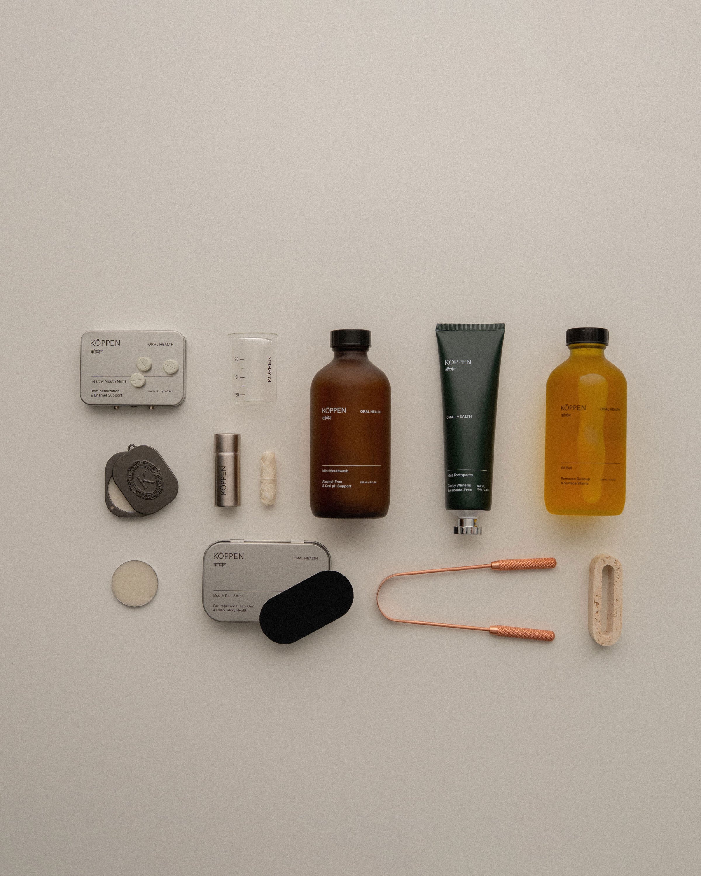 Collection of oral care products on a light gray background