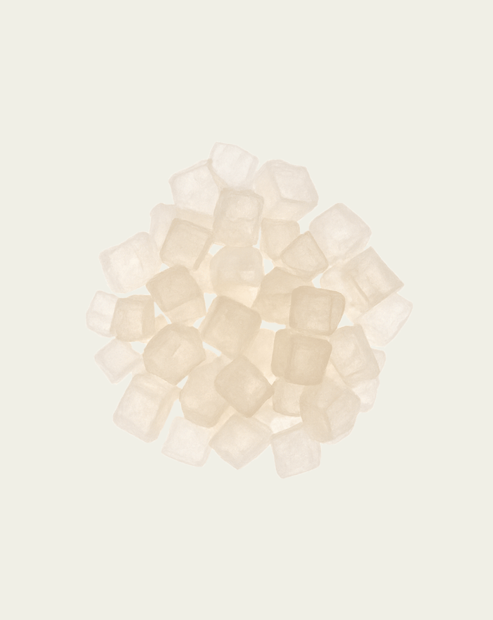 Group of xylitol cubes on a light beige background