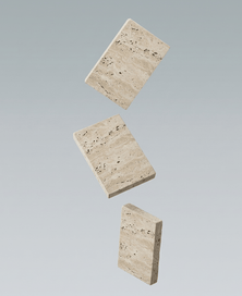 Three beige travertine stone tiles of different sizes on a gray background
