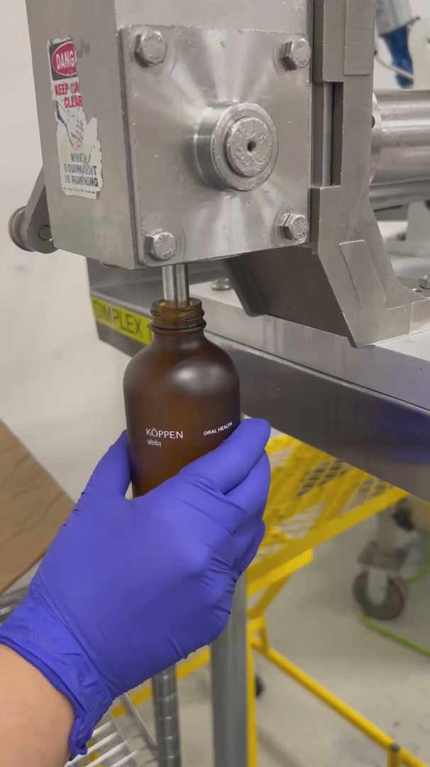 Video of oral care bottles being being filled in a factory