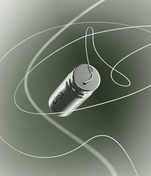 Silver cylindrical floss container with 'Koppen' branding on a green gradient background