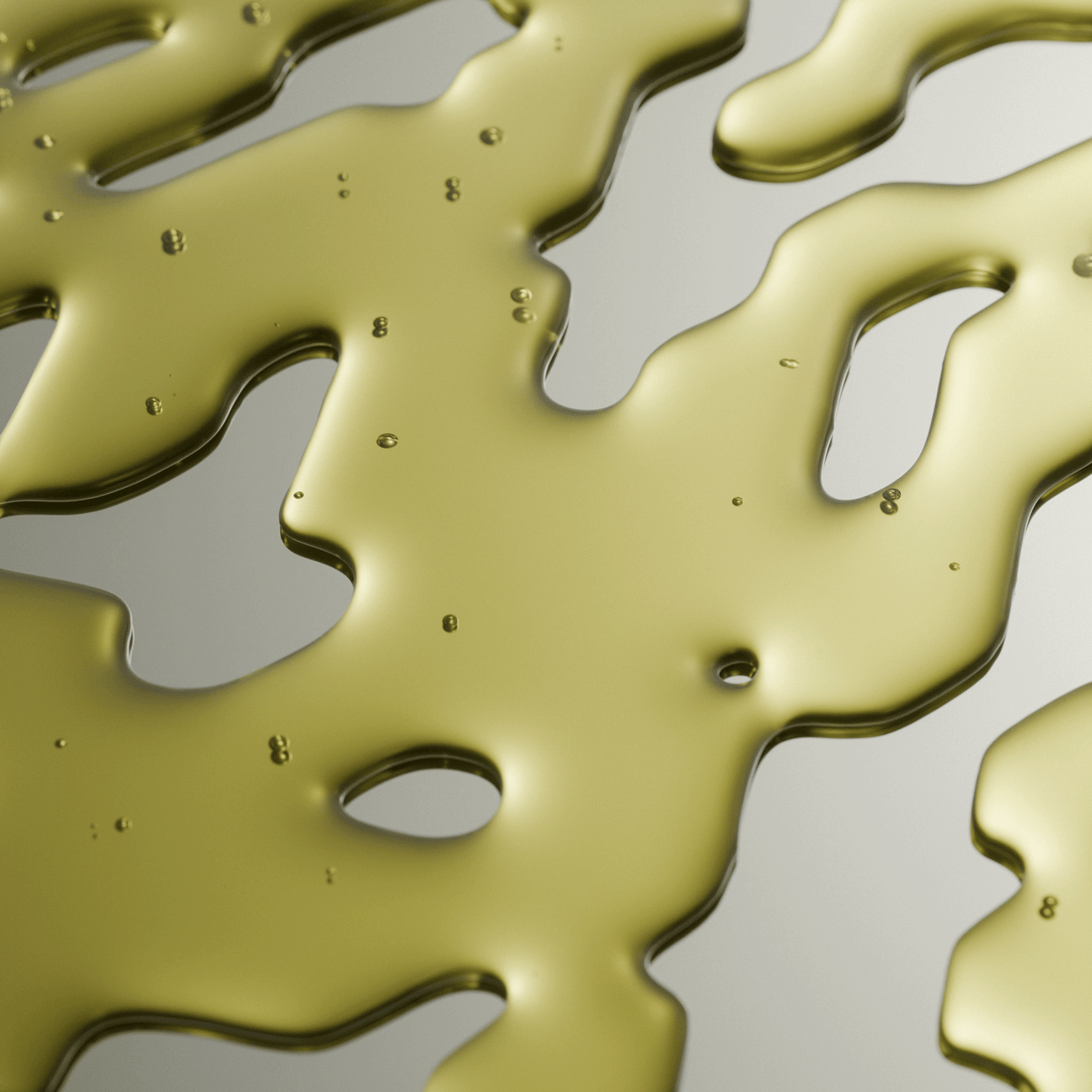 Close-up of gold liquid on a gray background