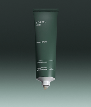 Koppen toothpaste tube on a gradient green background